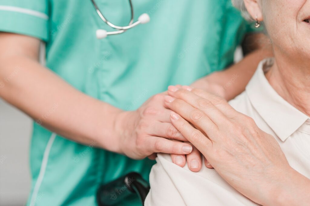 senior-woman-patient-touching-female-nurse-hand-shoulder_23-2147861496